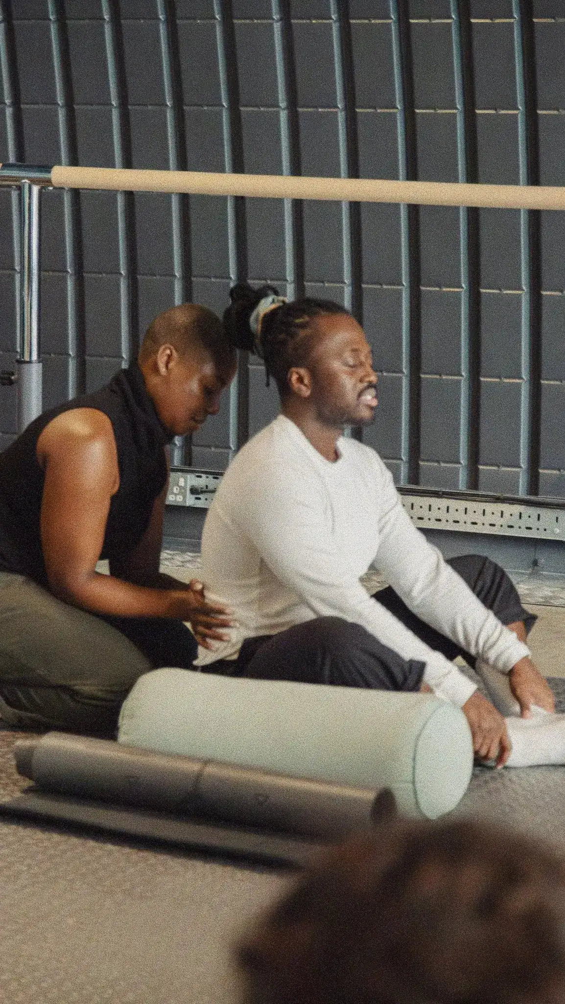 Massage therapist working on a seated client